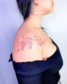 a woman with a tattoo on her shoulder