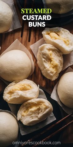 steamed custard buns on a wooden table with text overlay that says steamed custard buns