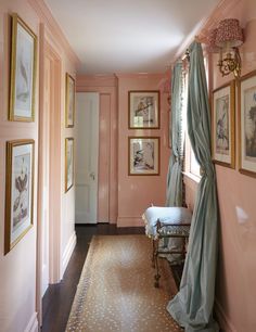 a pink hallway with pictures on the wall and an open window in the corner that says instagram