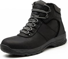 a pair of black work boots on a white background