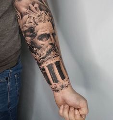 a man with a tattoo on his arm