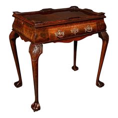 an old wooden desk with ornate carvings on it