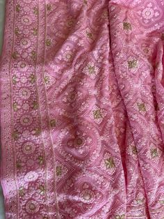 This Elegant And Gorgeous Chikankari Silk Saree is on Pure Georgette Silk! It has outstanding finished Lucknow Chikankari Embroidered with Mukaish and Gotapatti Embroidered work all over the body and Pallu!! **Perfect For Any Bridal / Big Party Occasions** Chikankari sarees are traditional Indian garments known for their intricate white-on-white embroidery work. They originate from Lucknow, India, and are prized for their craftsmanship and elegance. These sarees are often made from lightweight fabrics like cotton or chiffon and are adorned with delicate hand-embroidered motifs, making them popular choices for special occasions and weddings. Chikankari work can include various stitches and patterns, creating a unique and timeless look. Transitional Season Pink Salwar Kameez With Cutdana, Pink Raw Silk Pre-draped Saree With Resham Embroidery, Pink Art Silk Pre-draped Saree With Intricate Embroidery, Pink Raw Silk Pre-draped Saree With Dupatta, Pink Anarkali Style Silk Pre-draped Saree, Festive Pink Silk Pre-draped Saree, Pink Silk Pre-draped Saree In Traditional Style, Traditional Pink Silk Pre-draped Saree, Pink Wedding Pre-draped Saree