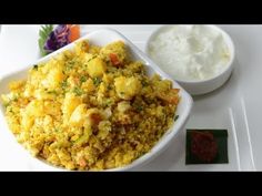 a white bowl filled with food next to a small bowl of cottage cheese and sour cream