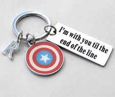 a captain america keychain with an i'm with you til the end of the line on it