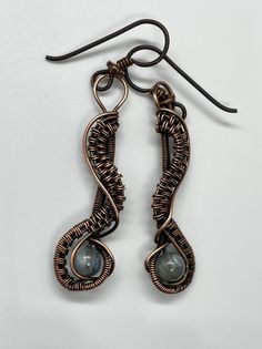 Wire Wrapped Copper Earrings with Labradorite and Niobium Ear Wires. Niobium, which is naturally hypoallergenic, making this ear wire especially suited for customers with metal sensitivities. Approximately 1 7/8" long from the top of the ear wire and 3/8" wide. Based on a Nicole Hanna Design. These Earrings have been antiqued, polished and sealed. Sealed with Protectaclear. ProtectaClear is a clear, protective coating that is tough enough to protect jewelry and is safe for wear against skin. Pro Simple Wire Earrings, Hanna Design, Diy Beaded Rings, Wrap Earrings, Diy Wire Jewelry, The Ear, Wire Wrapped Earrings, Beads And Wire, Wire Earrings