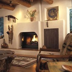 a living room filled with furniture and a fire place