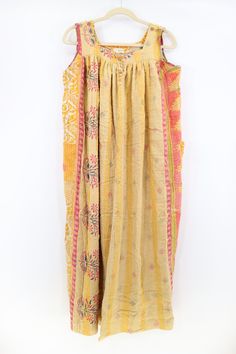 Get comfortable in this kantha maxi dress. Reminiscent of grandma’s Muumuu, this oversized dress features two deep outer pockets and is sewn from vintage cotton saris. Functioning buttons at the shoulders and neckline. Care Instructions: Hand wash and line dry for longest life. Disclaimer: The material used in this style is repurposed, vintage material. Small imperfections may be present. Fabrics may have small threads or holes in the layers. Small stains may be found. This is a “one size” style Yellow Cotton Saree Dress, Yellow Bohemian Saree Dress, Bohemian Festive Maxi Dress With Chikankari Embroidery, Festive Bohemian Maxi Dress With Chikankari Embroidery, Repurposed Vintage, Oversized Dress, Vintage Saris, Vintage Material, Handmade Charms