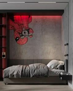 a bedroom with a spiderman mural on the wall