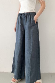 The Island Time Wide Leg Linen Pants in Midnight Blue are a dream pair of summer pants! The natural fabric and lightweight feel make them ready for your next summer vacation! Featuring an elastic waistband, linen fabric, wide legs, pocket, midnight blue color, oversized fit and a lightweight feel. Style these linen pants with an effortless tank top and sandals! Details & Sizing Elastic waistband Linen fabric Wide leg Pockets Midnight blue color Oversized fit Lightweight feel Gabriella is wearing Blue Flowy Pants, Summer Linen Outfits, Outfits For The Week, Midnight Blue Color, Linen Bottoms, Outfits Modest, Modest Outfit, Grayish Blue, Greyish Blue