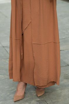 Introducing the Deluna three piece maxi lightweight abaya in rustic brown. This elegant and versatile design is perfect for any season and includes a long sleeve slip dress, apron piece, and a throw over abaya. The fabric is specially designed to resist wrinkles and the contrast brown color overlook seam at the edge of the abaya stands out.The abaya is super lightweight and flowy making it perfect for hot weather. The apron piece allows you to adjust the fit and the pattern of the abaya is not o Modest Activewear, Full Coverage Swimsuit, Dress Apron, Abaya Dress, Rustic Brown, Hot Weather, Three Piece, Active Wear Tops, Trousers Women