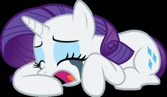 a white pony with purple hair laying on its back