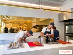 two men are preparing food in the kitchen