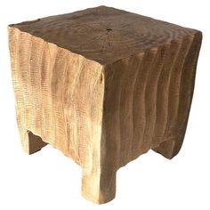 a small wooden stool made out of wood