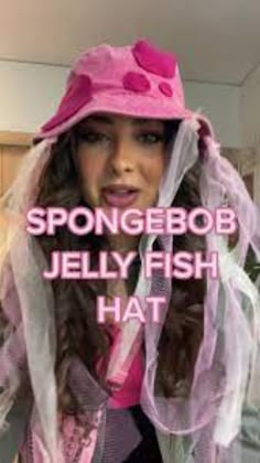 a woman wearing a pink hat with the words spongebob jelly fish hat