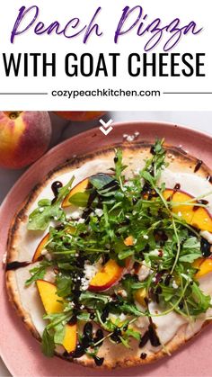 a pink plate topped with a pizza covered in greens and peaches