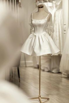 a mannequin with a wedding dress on display