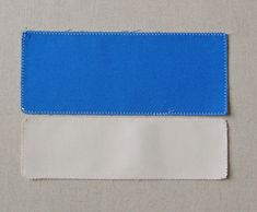 two white and blue pieces of cloth sitting next to each other