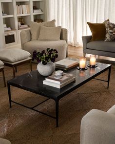 a living room filled with furniture and a coffee table