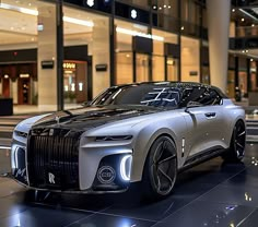 a futuristic car is parked in front of a building