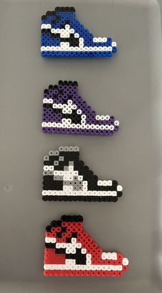 three different types of shoes made out of perler beads on a gray surface with white and black dots