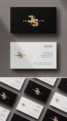 some business cards with gold foil on them and black and white paper in the middle