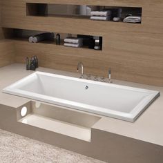 a white bath tub sitting on top of a counter