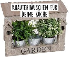 an outdoor garden with potted plants and a sign that reads, kaufterhausschen fur deine kuche