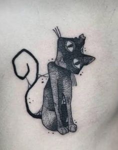 a black and white cat tattoo on the chest