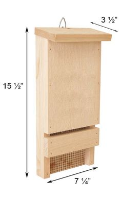 a wooden bird house with measurements for the top and bottom