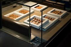 there are many different types of food in the display case