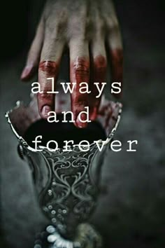 a person's hand reaching into a vase with the words, always and forever