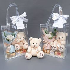 two clear bags filled with teddy bears sitting next to each other