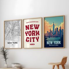 there are three posters on the wall in this living room, one is new york and the other is new york