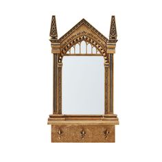 a wooden mirror with an ornate design on it