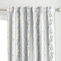 a curtain with blue and white designs on it