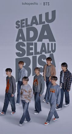 several young boys are walking in front of a large advertisement for selajuada selau