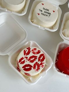 several small trays filled with different types of cakes