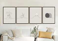 three paintings hang on the wall above a white couch in a living room with pillows