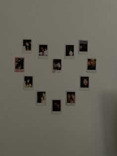 a white wall with many pictures arranged in the shape of a clock on it's side