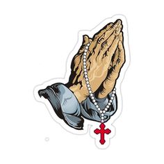 a sticker with an image of praying hands and a cross