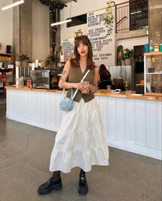 Long Skirt With Button Down Shirt, Long Skirt Vest Outfit, 70s Street Style Vintage Photos, White Midi Skirt Outfit Aesthetic, Float Skirt Outfits, White Peasant Skirt Outfit, Styling White Maxi Skirt, White Tiered Maxi Skirt Outfit, Tiered Skirt Outfit Summer