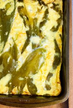 a casserole dish with green peppers and cheese