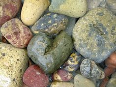 many different colored rocks on top of each other