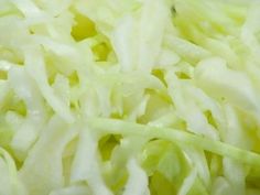 close up view of shredded cabbage on white plate