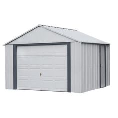 a white garage with grey trim on the side