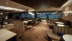 the interior of a restaurant with wooden flooring and tables, chairs, and booths