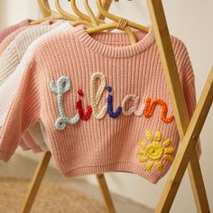 Personalized Baby Name Sweater, Baby Knit Sweater With Name, Newborn Sweater,Baby Coming Home Outfit,Baby Shower Gift,Newborn Gift,Baby Gift  Welcome to Our Boutique: Exquisite Handcrafted Baby/Toddler Sweaters At our boutique, we take pride in our artistry of crafting custom and personalized baby/toddler sweaters, each adorned with the child's cursive name, intricately hand-embroidered on the chest or back using either coarse or super coarse yarn. Every sweater is a testament to our meticulous Baby Sweater Embroidery, Name Sweater Baby, Baby Knit Sweater, Sweater With Name, Baby Name Sweater, Newborn Sweater, Name Sweater, Outfit Baby Shower, Baby Coming Home Outfit