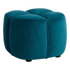 a small blue ottoman sitting on top of a white floor