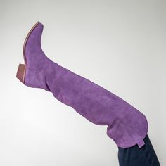 Step out in our knee high suede Laramie Boot . These boots are Western with a modern sleek design, and a wooden heel. You will be turning heads of Cowboys and City Slickers alike. Made in Italy Lilac Suede Light Purple Boots, Lavender Cowboy Boots, Purple Suede Boots, Fitted Purple Western Boots, Chic Purple Ankle-high Boots, City Slickers, High Wedges, Princess Shoes, Wooden Heel